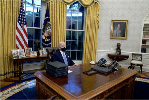 President Biden sits in the Oval Office of the White House in Washington, D.C., on Jan. 20, 2021. He signed his first executive orders. Photo Courtesy of politico.com
