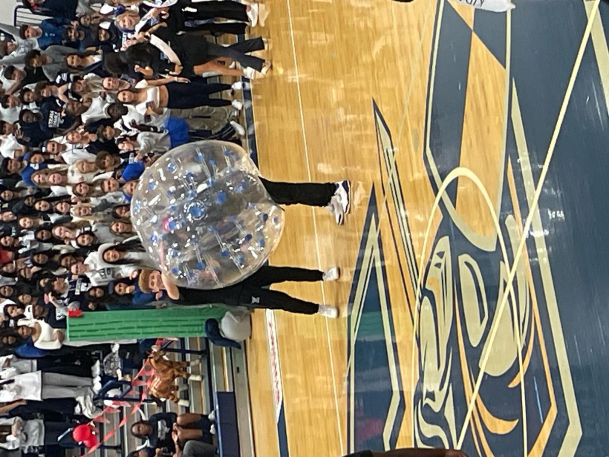 Kabeer Hanjra is assisted out of his Hamster Ball by Cameron Petrey after the Bull Rush event. The Dodgeball game was cancelled