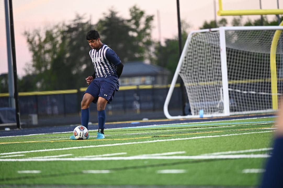 Junior Nikhil Jones of the Knights playing the Gainesville High School Boys’ soccer team on March 3rd, 2023 at John Champe High School. This was the second game of the season, and the Knights lost 4-3.