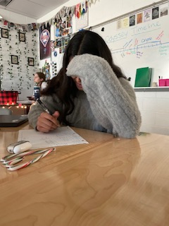 Student studying for a math test on the last week of school before winter break.