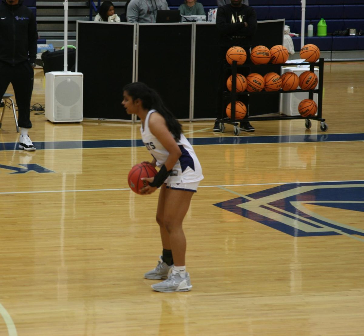 Anika Badatala is taking the ball up to court as she scores her third three pointer of the game. Playing guard, she helped lead her team to victory