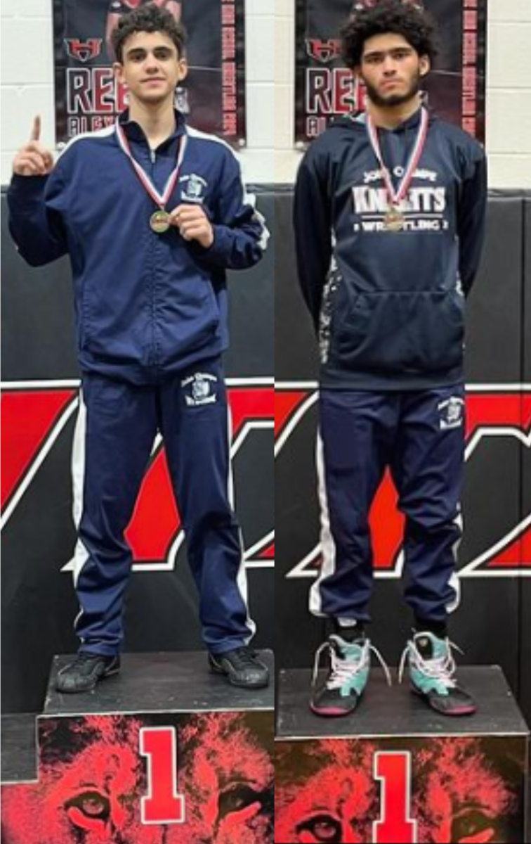 District champion wrestlers Ramez Hana and Isa Ghorbanni. (Photo courtesy of Joel Elmquist)