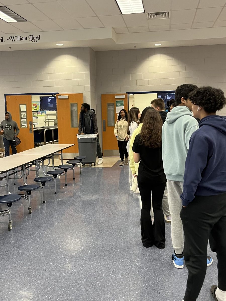 Mr. McDonald is monitoring the lunch lines. He made sure no one cut and everyone waited their turn fairly. 