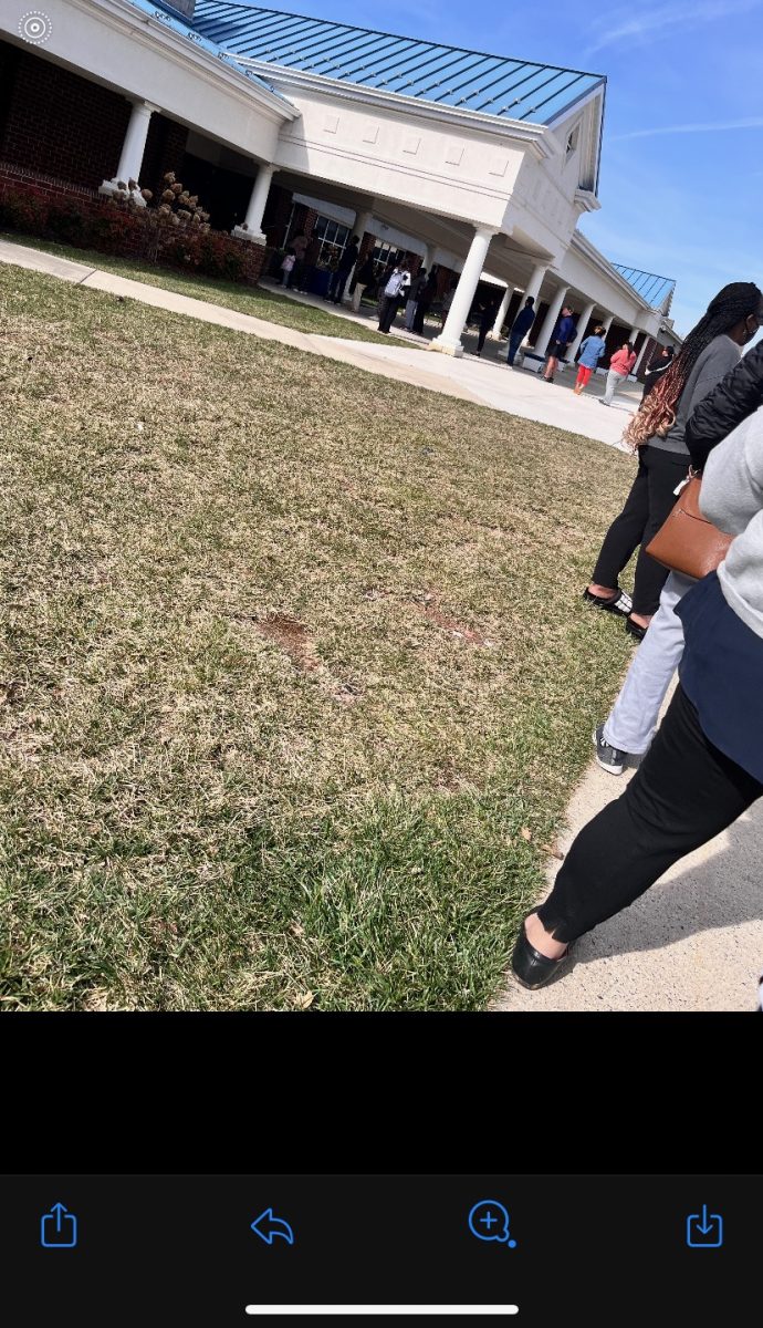 Parents waiting outside Mercer Middle School to pick up their kids from school.