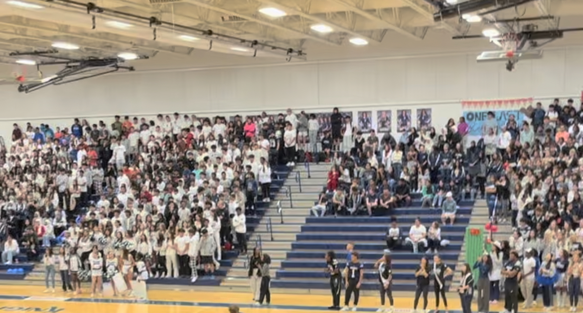 This photo shows the students in the stands participating in the event.