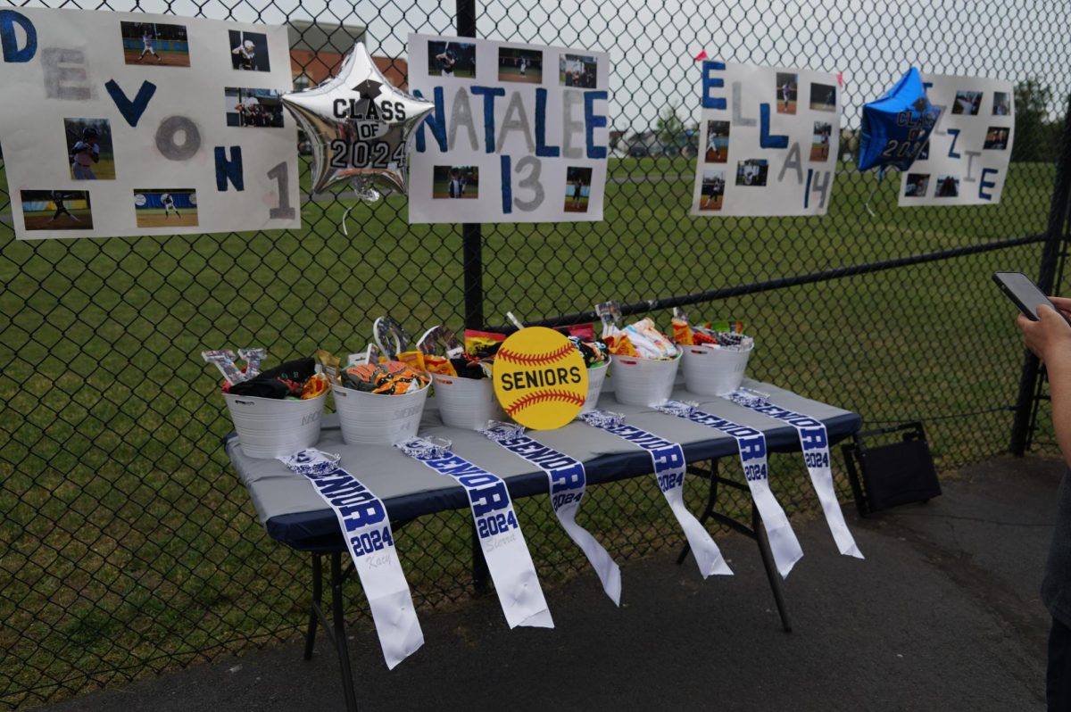 The seniors after game gifts displayed next to the dugout. The underclassman came together to put together gifts for each of the seniors.