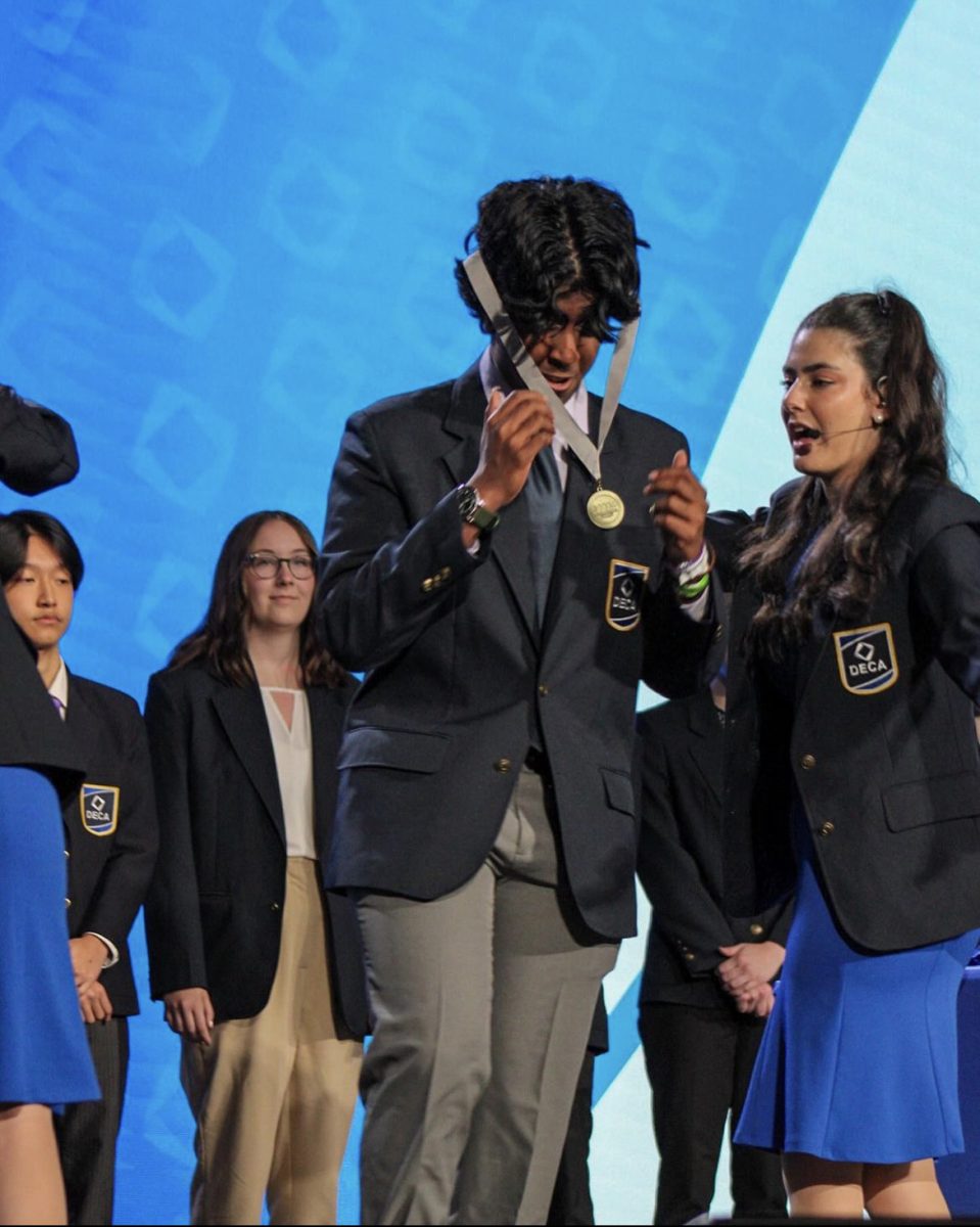 Aditya Kalva receives his silver ribbon at ICDC event.