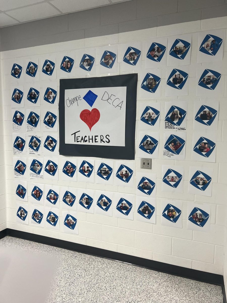 Pictorial collage of students with their favorite teachers posted on the wall by the Armory.
