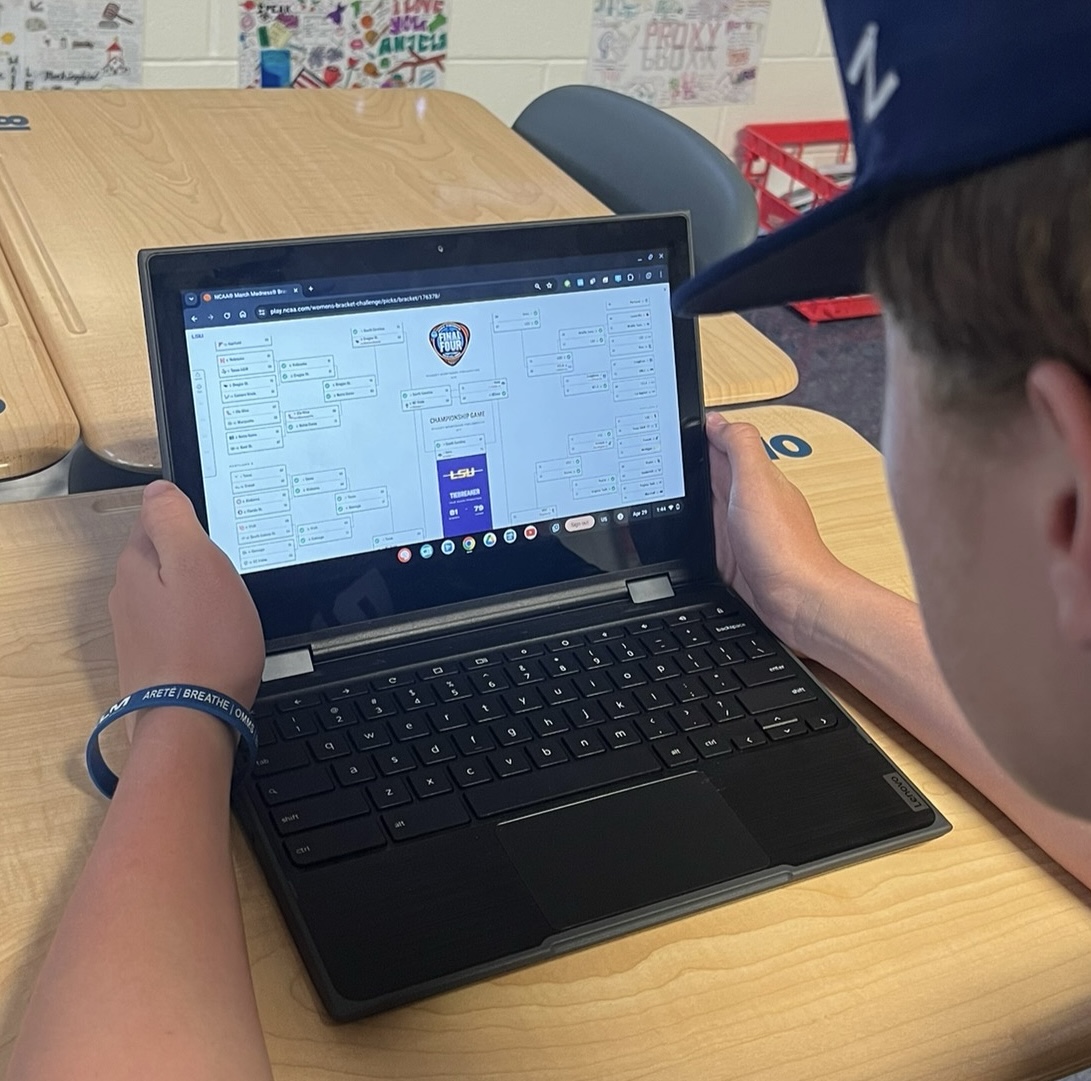 Student Owen Mollerup looking at his Final Women’s March Madness bracket after the end of the tournament. A lasting tradition for fans of both tournaments is the process of filling out brackets, predicting which teams will and will not make it to the finals. Millions of brackets are filled out at the start of each tournament.