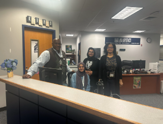 Dr. Rogers is pictured with the staff members in the front office. This photo was taken earlier this week after Dr.Rogers finished lunch duty. 