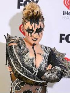 JoJo Siwa wore the costume and makeup on the red carpet from the “Karma” music video to promote her song. This picture was taken at the 2024 iHeartRadio Music Awards.  