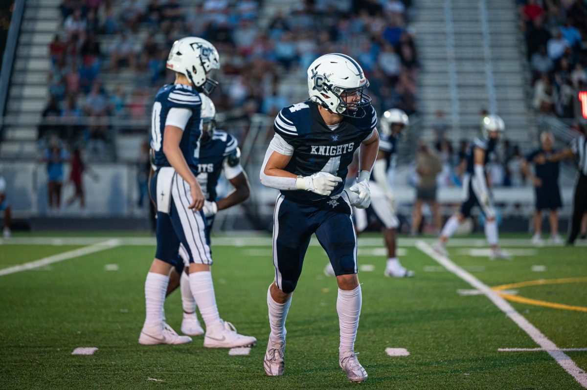 Dom Plush and Tyler Kann get ready to run plays against Lightridge.