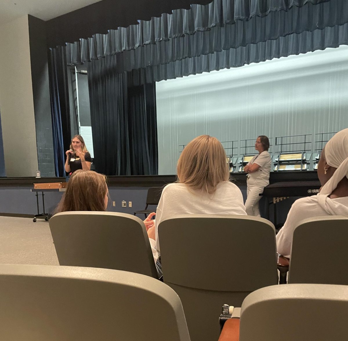 A representative from Columbia University is talking to students about applying to the university. Most students were interested in the factors the admissions office considers. 