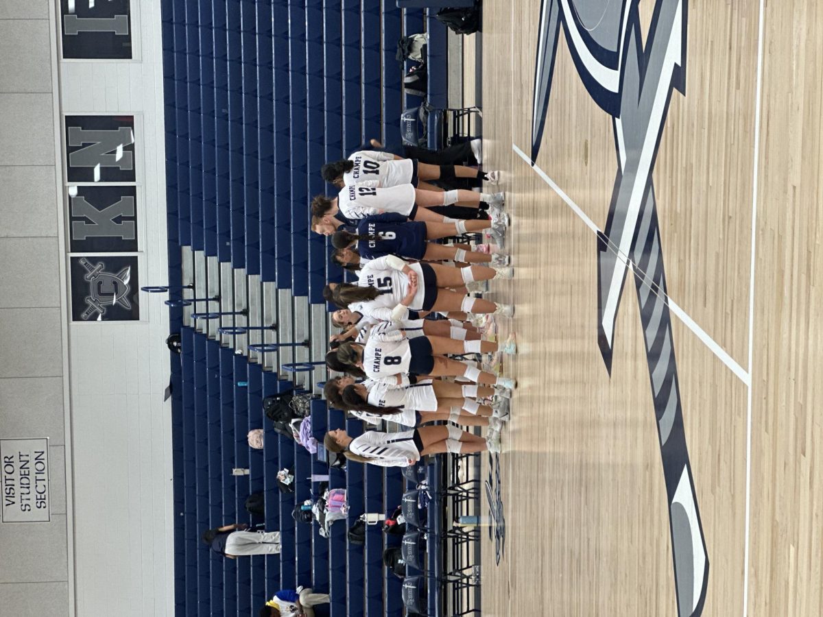 The John Champe JV Volleyball team during a time out in their game against Riverside. The Knights were losing in the first set and took a timeout to regroup.  