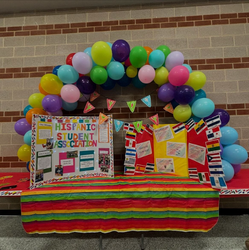 Hispanic Student Association's table set up at the entrance of the school to celebrate Hispanic Heritage Month (Photo courtesy of @jchs_hsa on Instagram)