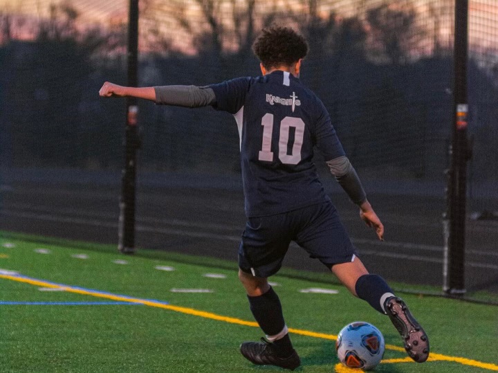 Mikhail Ibrahim is suited up playing for the John Champe boy's soccer team. He played from his freshman year to now. 