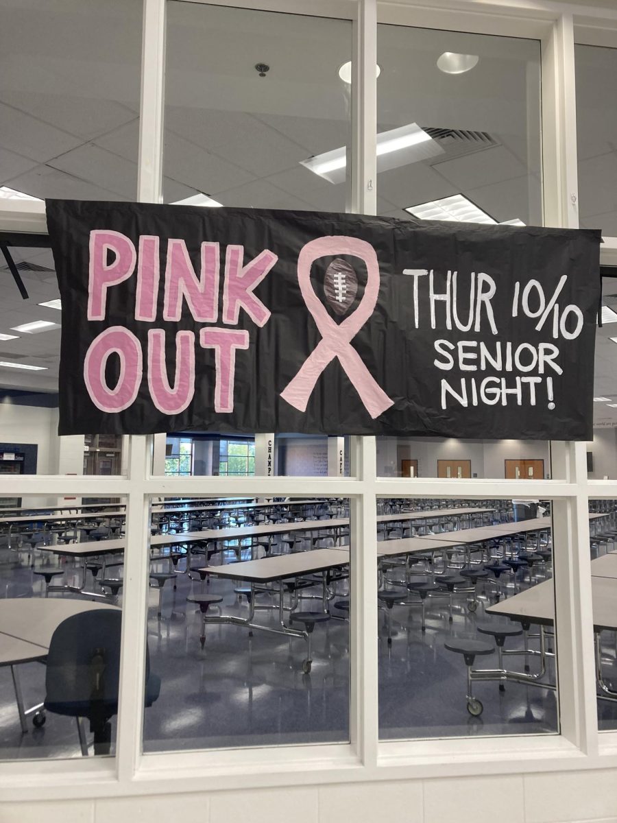 A pink out banner has been hanging by the cafeteria. 