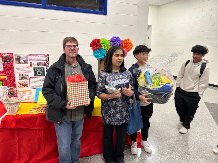 The three winners of the raffle contest that took place during Noche Latina 2024.