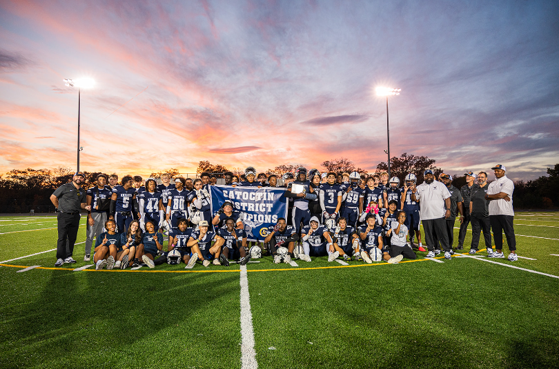 John Champe High School varsity football team receiving the district championship banner. Champe received the banner with a 10-0 overall record. 