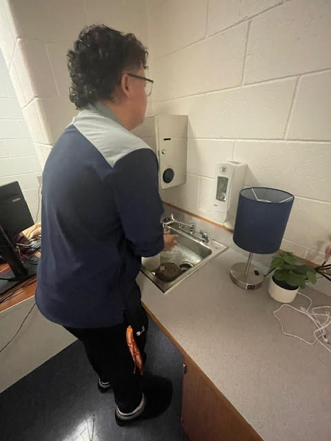 Junior Jackson Casetta washes his hand after an activity to prevent germs and stay safe.