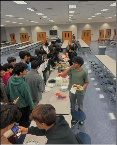 DECA Friendsgiving celebration where students wrote cards and enjoyed a meal together.