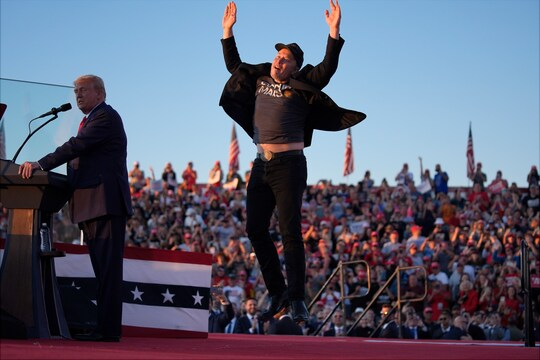 Elon Musk jumps on stage to cheers from the crowd at a rally of Former President Donald Trump on October 5th, 2024 in Butler, PA. Musk had previously voiced his support for Trump, but this marked his first appearance at one of his rallies.