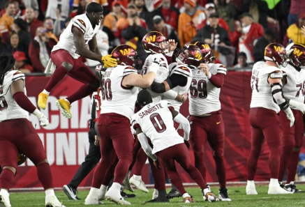 Commanders celebrating after win. Photo Courtesy of AP News